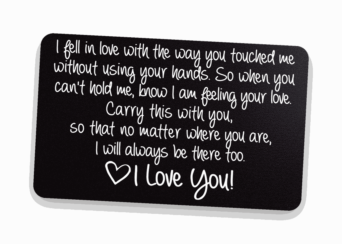 Black engraved love-note metal wallet card on warm linen — romantic keepsake gift for your boyfriend